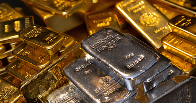 Gold settles lower as dollar rises